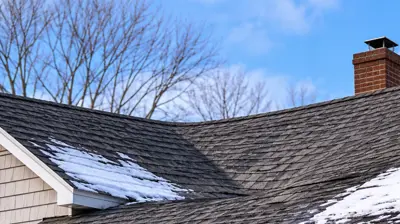 Drone view of a residential roofline in Cumberland Rhode Island showing a subtle sag after heavy wet snow.