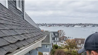 Curling asphalt shingles on a roof in Warwick Rhode Island