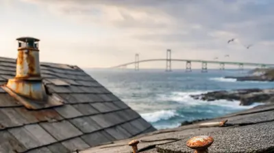 Close-up of asphalt roof shingles with rusted roofing nails and corrosion caused by coastal salt air exposure in Newport, Rhode Island.