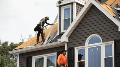 A team of roofers from a local roofing company
