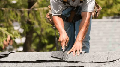 Roofing contractor installing new roof
