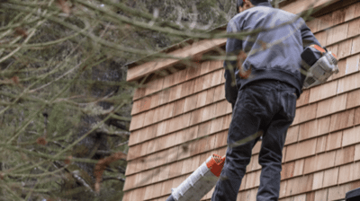 contractor providing professional fall gutter cleaning