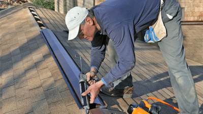 contractor performing roof ventilation installation