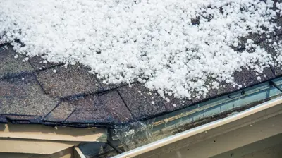 Frozen gutter clogs repair by a local gutter contractor