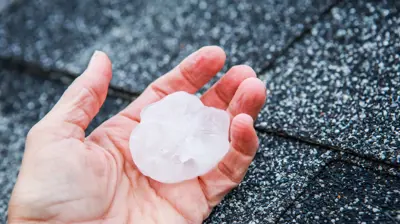 Hail impact damage documented on a 10-year-old architectural shingle roof in the Garlic Creek neighborhood of Buda TX 78610