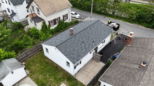 Roofing crew works on roof replacement