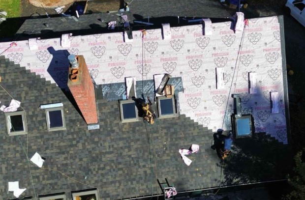 Mighty Dog Roofing technician providing roofing service in Ayer, MA with care and local expertise. Roofing Company near me.