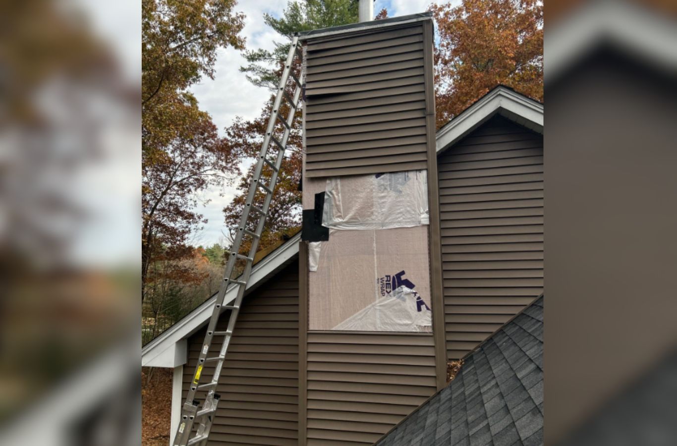 A Mighty Dog Roofing of Greater Middlesex County technician completing siding installation in Bedford, MA, showing craftsmanship and local expertise. Siding Company near me.