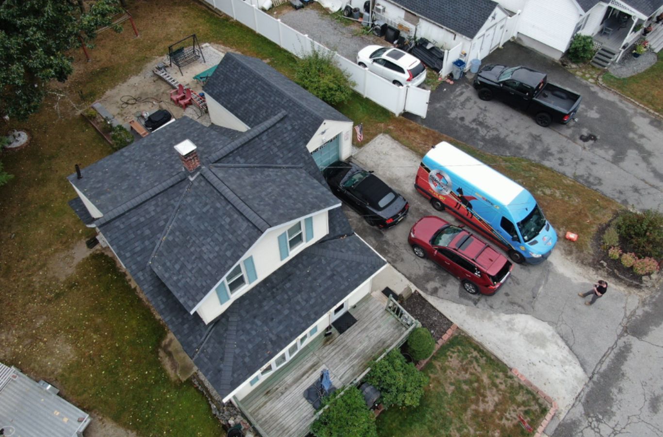 A Mighty Dog Roofing of Greater Middlesex County professional completing siding installation in Burlington, MA, demonstrating local expertise and quality work. Siding Company near me.