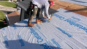 Full tear-off and deck inspection in progress on a Golden, CO home with foothills mountains visible in background