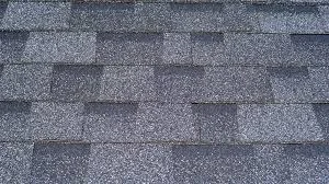 New Class 4 impact-resistant shingles installed with 6-nail pattern on a Golden, CO home with mountain backdrop