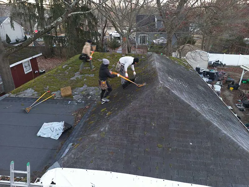 Moss-covered asphalt shingle roof in Deptford NJ before residential roof replacement
