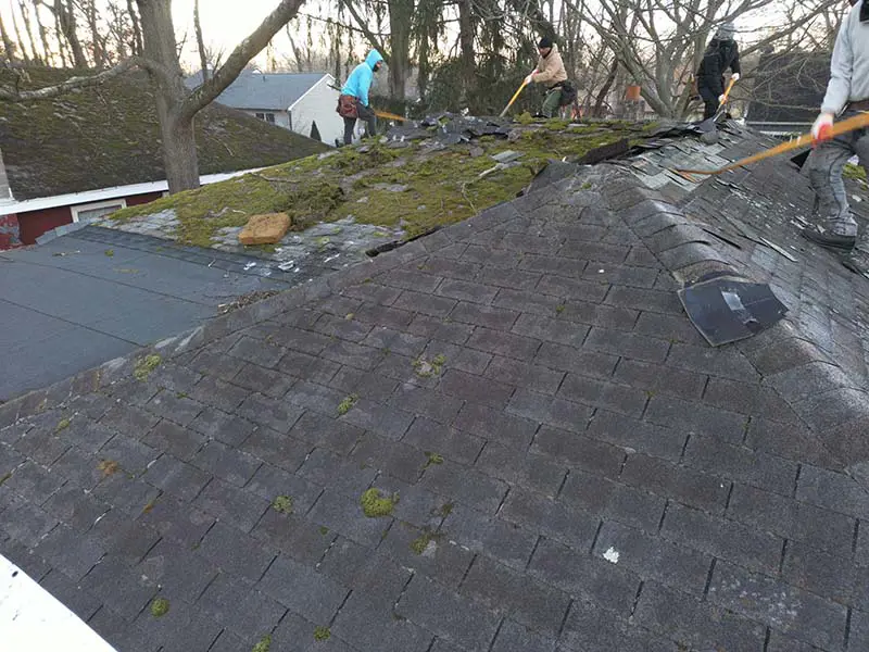 Old asphalt shingles being removed during roof replacement project in Deptford NJ