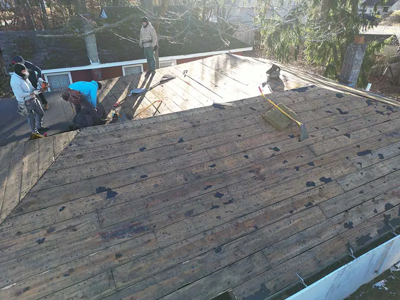 Roof tear-off process in Deptford NJ showing exposed roof decking during full residential roof replacement