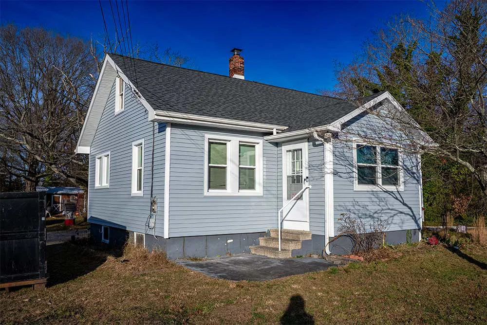 Completed siding and window replacement on a Vineland, NJ home with new vinyl siding and updated windows
