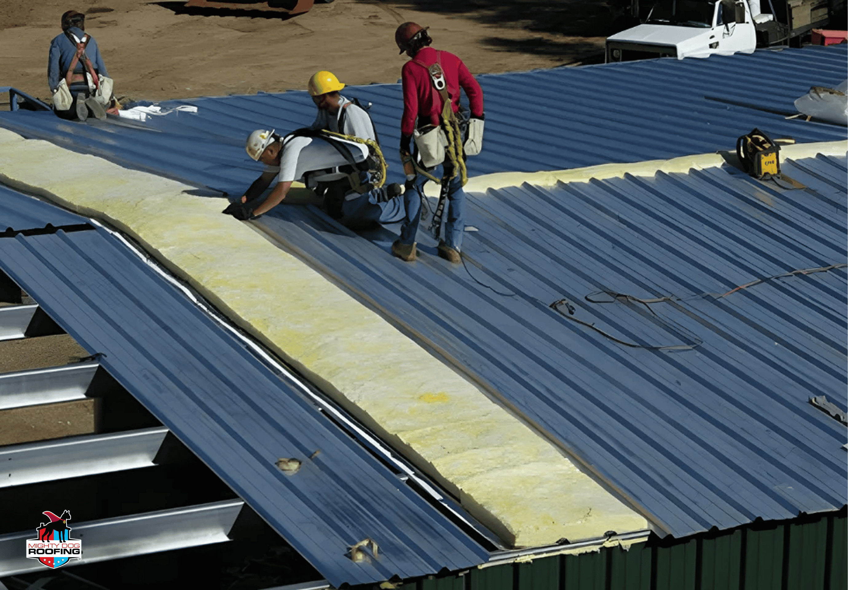 A crew installing insulation