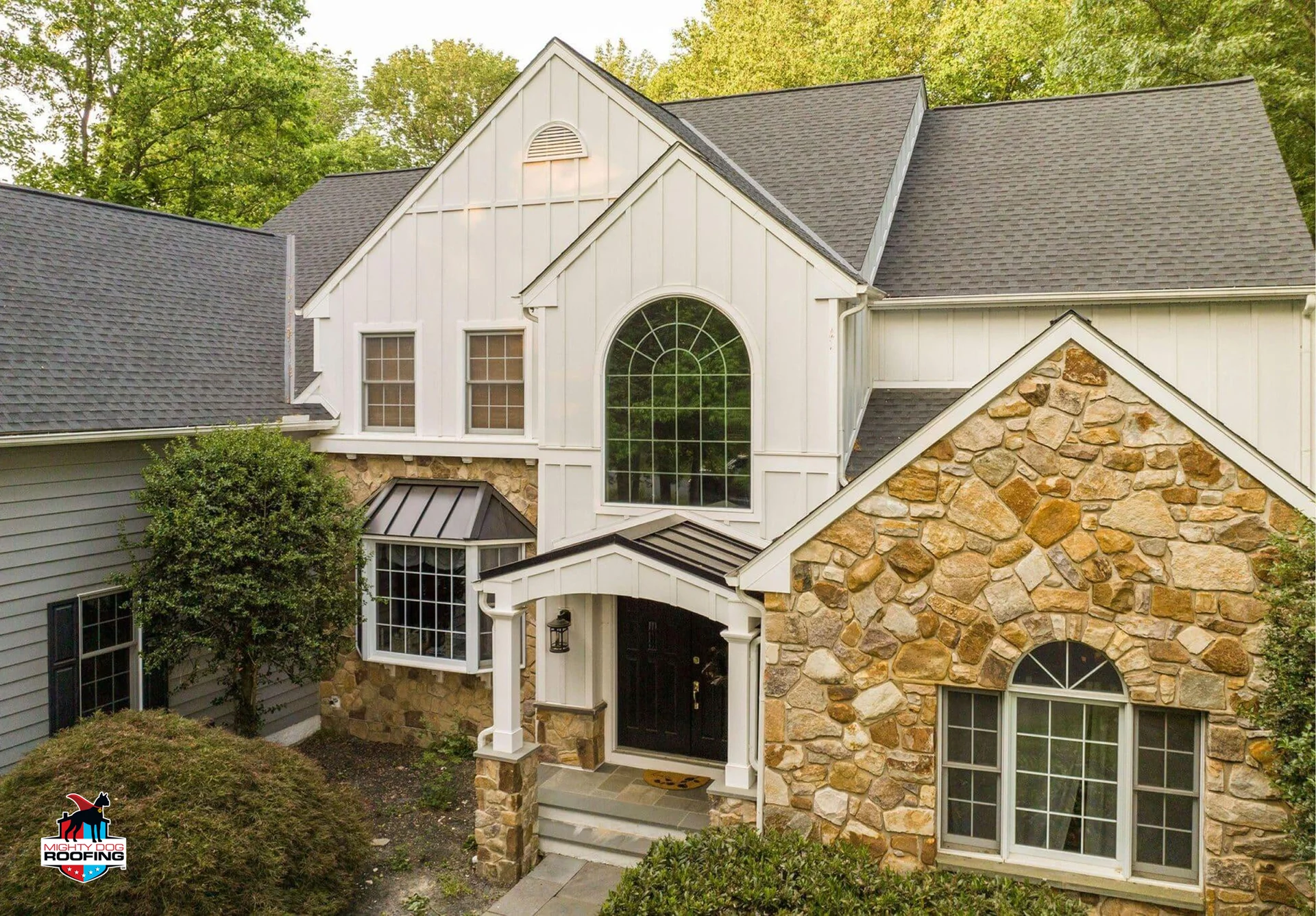 Large Chester County home with stone accents and light fiber cement siding